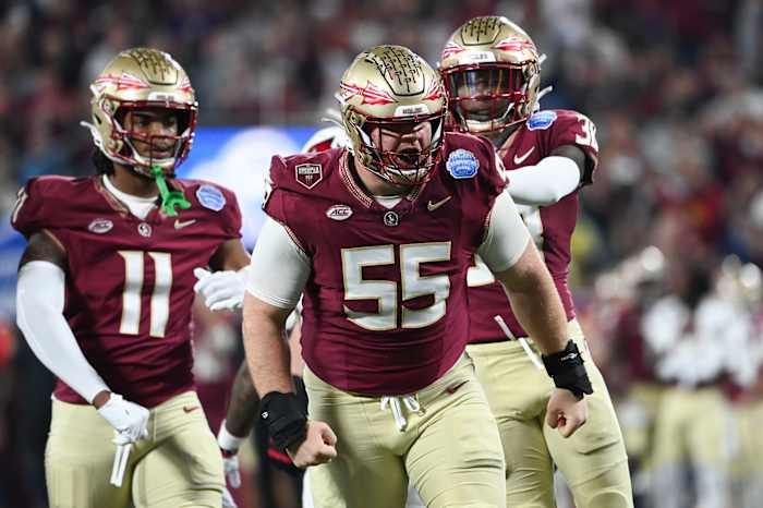 Dec 2, 2023; Charlotte, NC, USA; Florida State Seminoles defensive lineman Braden Fiske (55) reacts after a tackle on Louisville Cardinals running back Jawhar Jordan (25) in the first quarter at Bank of America Stadium.